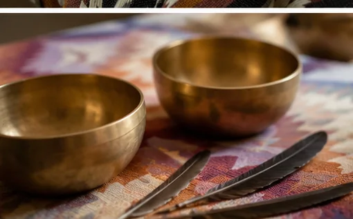 Singing bowls and feathers used during sessions